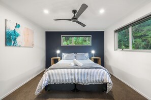 Master bedroom with King-size bed, blackout blinds, wardrobe & ensuite bathroom