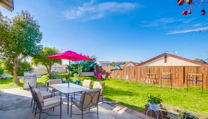 This spacious outdoor space is perfect for sunny get-togethers or BBQ nights