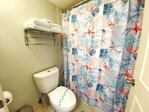 Enjoy a clean and bright bathroom with coastal charm.
