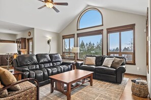 Upstairs, main living room with a Smart TV, gas fireplace & cozy seating options.