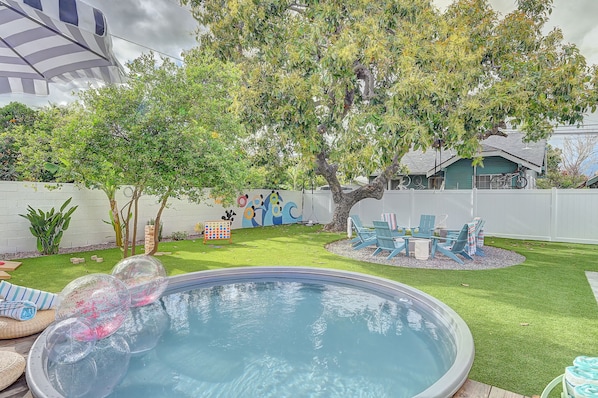 Trendy Tank Pool, Fire Pit, expansive lawn with yard games.