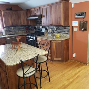 Spacious kitchen with modern appliances and center island