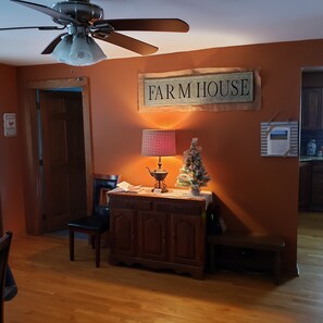 Common area with house rules posted on the wall