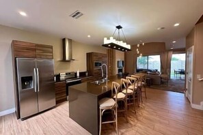 Full Kitchen includes fridge, freeze, ice cube machine, filtered water