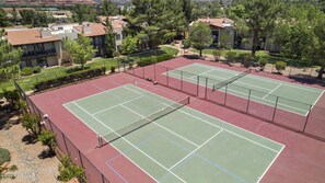 Tennis/pickleball courts are located just outside the condo