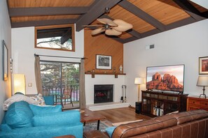 Fireplace, 65" smart TV, queen pull-out sofa & ceiling fan