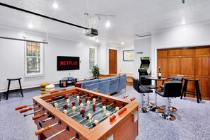 The Game Room features Foosball, an Arcade, a Nintendo console with pre-loaded classics, Board Games, and a 65-inch TV.