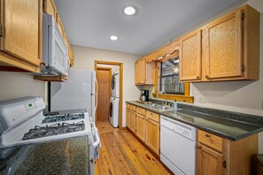 Kitchen with adjacent pantry and laundry