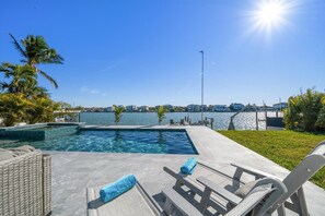 Soak up the sun on the gorgeous travertine patio overlooking the sea