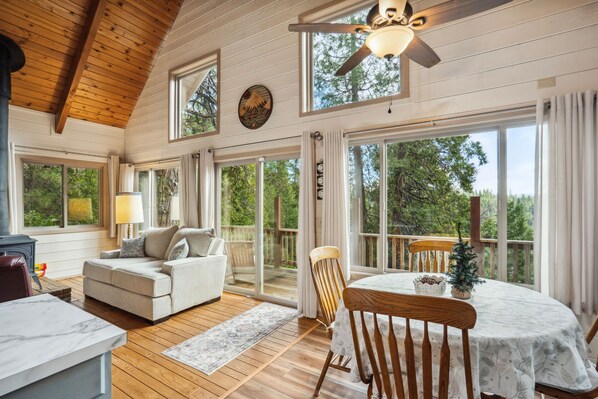 Large picture windows overlooking 3 acre parcel and Sierra Nevada Mountains