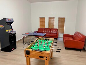 Amazing Game room with arcades, foosball and ping pong table