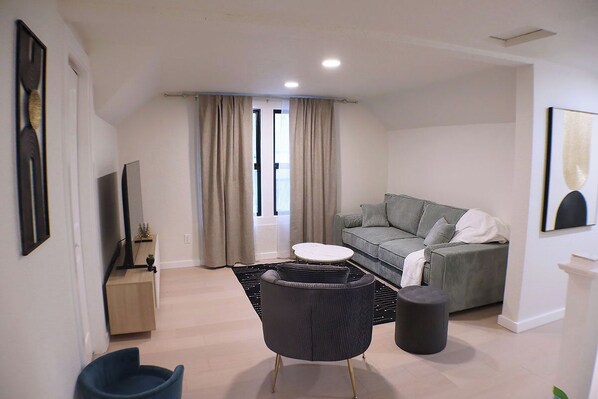 Bright and serene, this living room is perfect for unwinding or quality time.