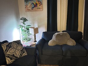 Common area- living room, love seat , full size couch