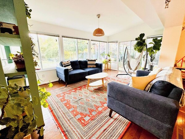 Sunny room with a view of the enclosed backyard.