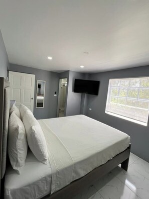 Second Bedroom with Queen bed and en suite bathroom
