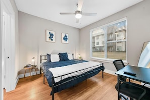 King Size Bed with Smart TV, Work Station, and Walk-in Closet