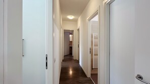 Corridor of bedrooms and bathrooms