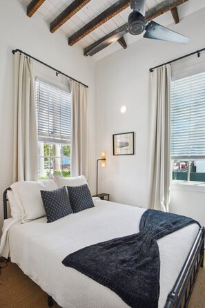 front bedroom with queen bed and large closet w/ hangers & full length mirror