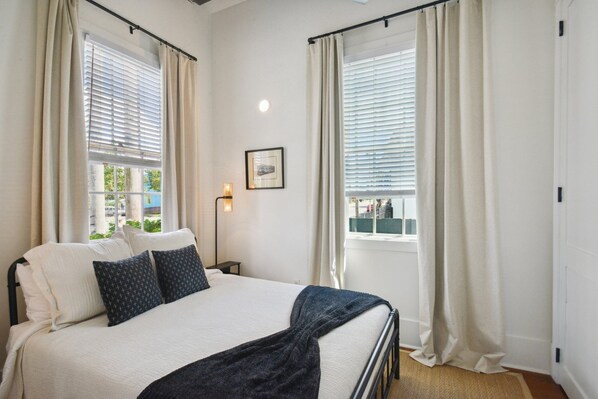 front bedroom with queen bed and large closet w/ hangers & full length mirror