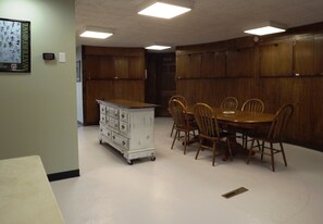 Spacious kitchen with prep island and large dining table.