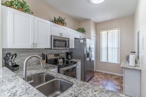 Bright and fully stocked kitchen