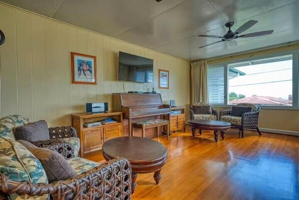 The living room piano and SMART TV