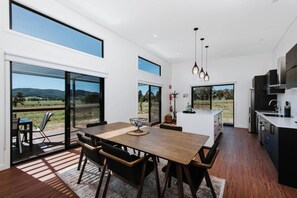 The open plan kitchen and dining area opens to the patio, creating a lovely transition between indoors and out.