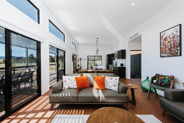 With sleek, contemporary finishes and ample natural light pouring in, this home seamlessly blends comfort with sophistication. 