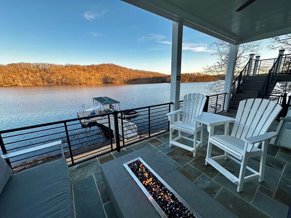 Open air porch off basement with large fire table. Propane provided.