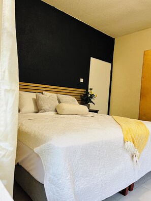 Master bedroom with king bed and closet
