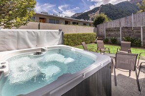 Private outdoor spa and patio area
