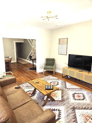 Large open living room with 50" Smart TV to stream all your favorites!