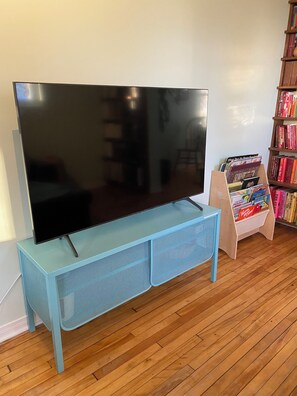 Our 55" Samsung Ultra HD 4K Smart TV with integrated Netflix, Prime, Disney+.