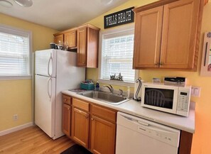 Microwave, toaster, coffee, pot, blender, pots, and pans, & many other amenities