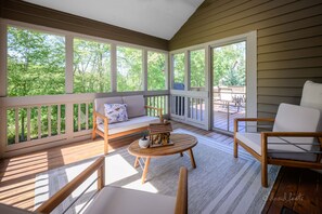 The screened in porch is off the dining room and is a great place to relax.