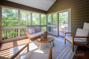 The screened in porch is off the dining room and is a great place to relax.