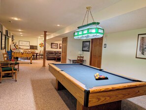 The lower level includes an 8-foot pool table and desk if you need to work. 