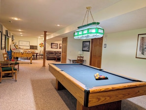 The lower level includes an 8-foot pool table and desk if you need to work.