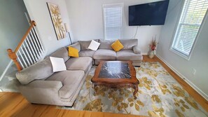 Large comfy sofa, large coffee table & TV for your entire family to enjoy!