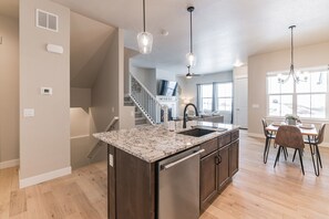 Our main floor flows from garage, to kitchen, to living room, to patio. 