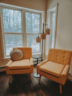 master bedroom window seating with wooded view