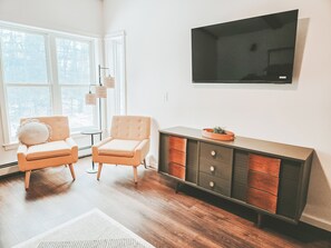 Master bedroom sitting area with 55 inch  TV.