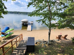 Short flight of stairs with handrail to lake