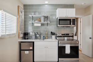 Cook full meals in this fully equipped kitchen.