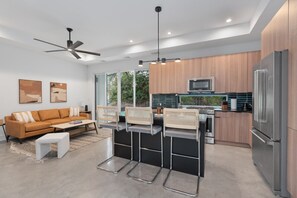 The kitchen features a stylish island, perfect for cooking and casual dining.