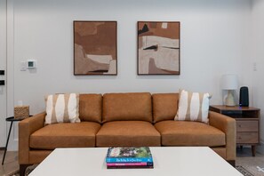 Warm and welcoming open concept living area that balances style and functionality.