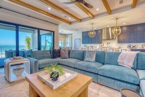 Gathering Room - Gorgeous wide open living area with beach front terrace for relaxing.