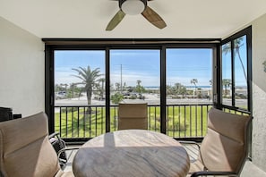 screened lanai with beach views