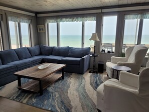 THE LIVING ROOM: Rest inside while taking in the views of outside.