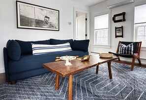 Relax in this airy space with natural light, a comfy couch